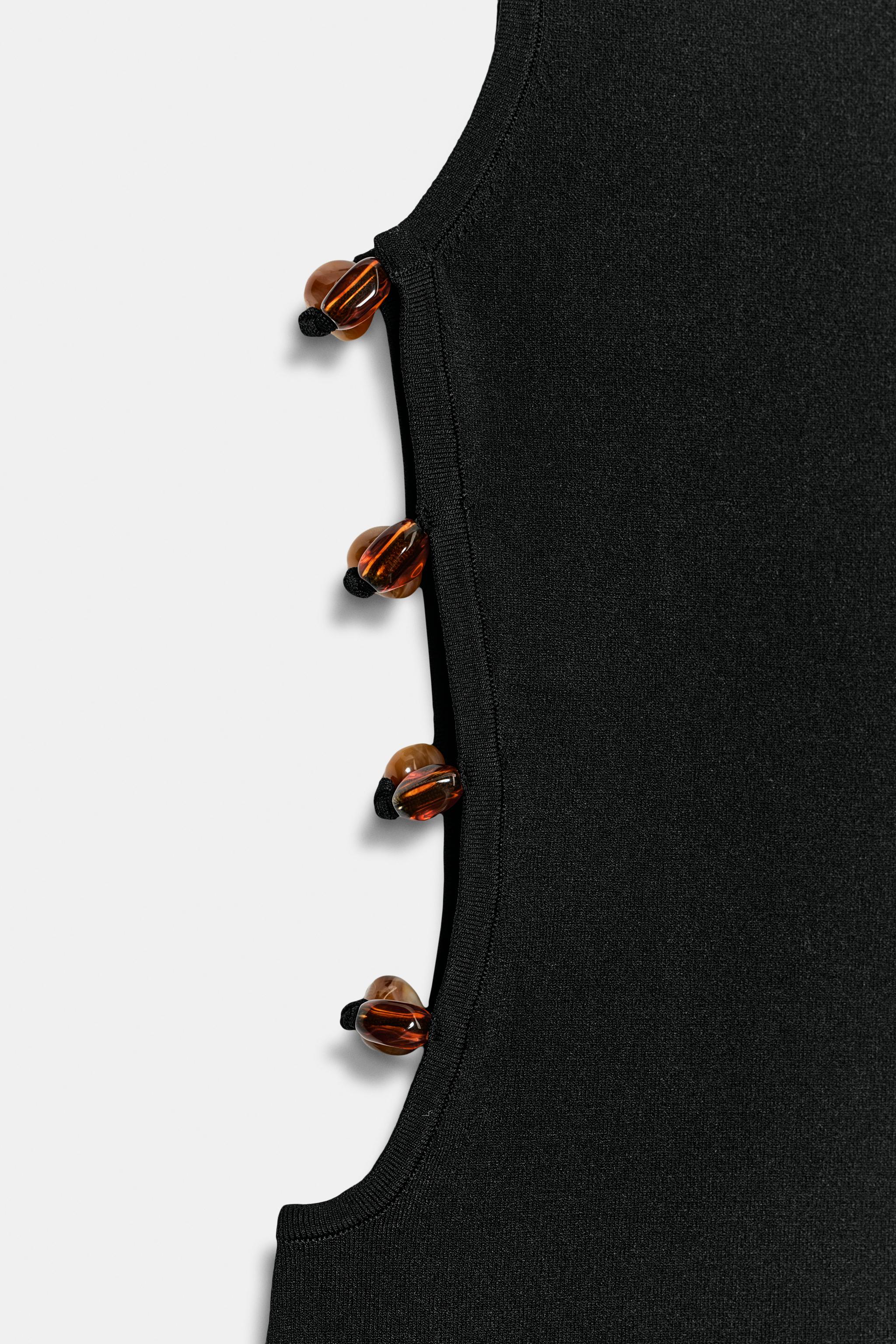 ROBE COURTE EN MAILLE À OUVERTURES FANTAISIE